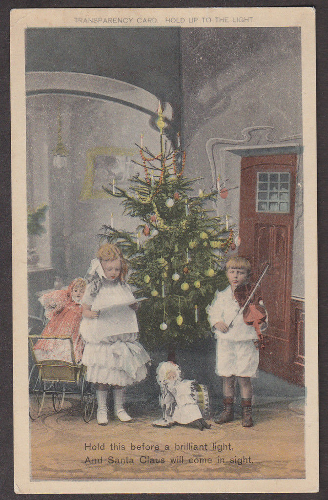 Christmas card with boy playing violin and girl singing (image)